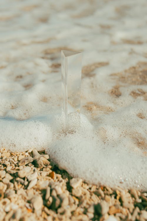 A small piece of glass sitting on the beach