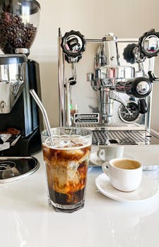 A detailed shot of coffee setup in a stylish café in İstanbul, showcasing brewing equipment and drinks.