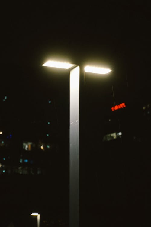 A street light is lit up at night