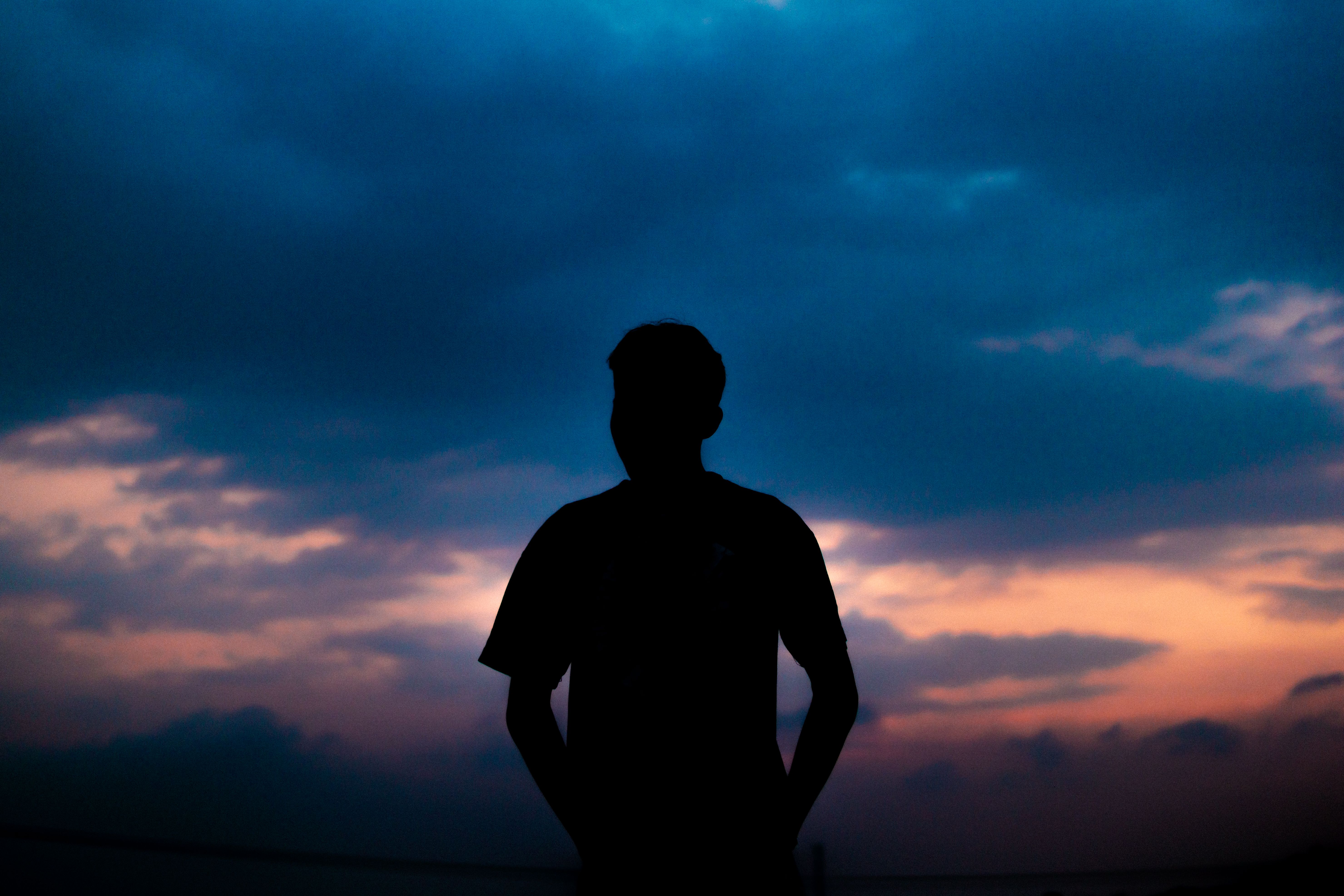 A Silhouette of a Man Looking at the Sky · Free Stock Photo