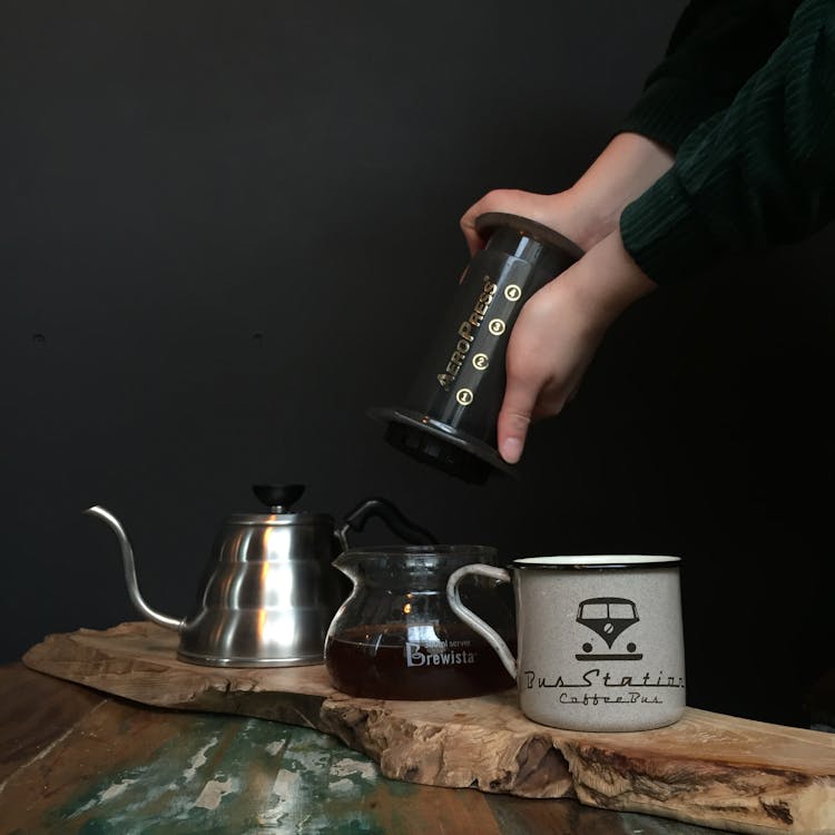 Free Person About to Put Aeropress Top Into Carafe Stock Photo