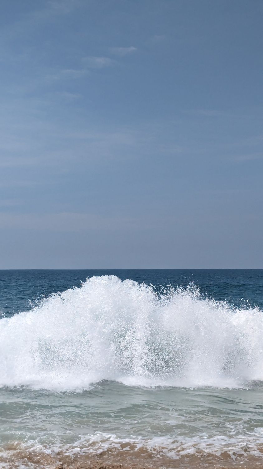Washing Wave View of a Foamy Wave Washing Up the Shore · Free Stock Photo
