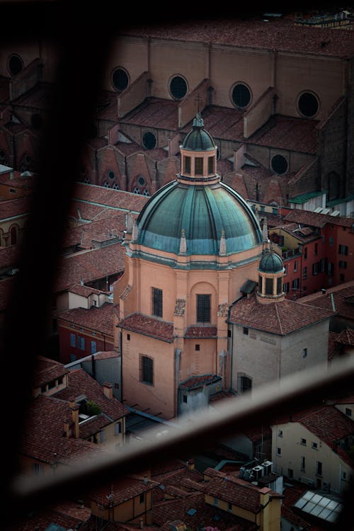 A view of a church from a window in a building