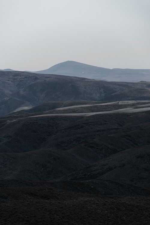 Free Captivating view of Mashhad's rugged mountains at dusk, offering a tranquil natural scene. Stock Photo