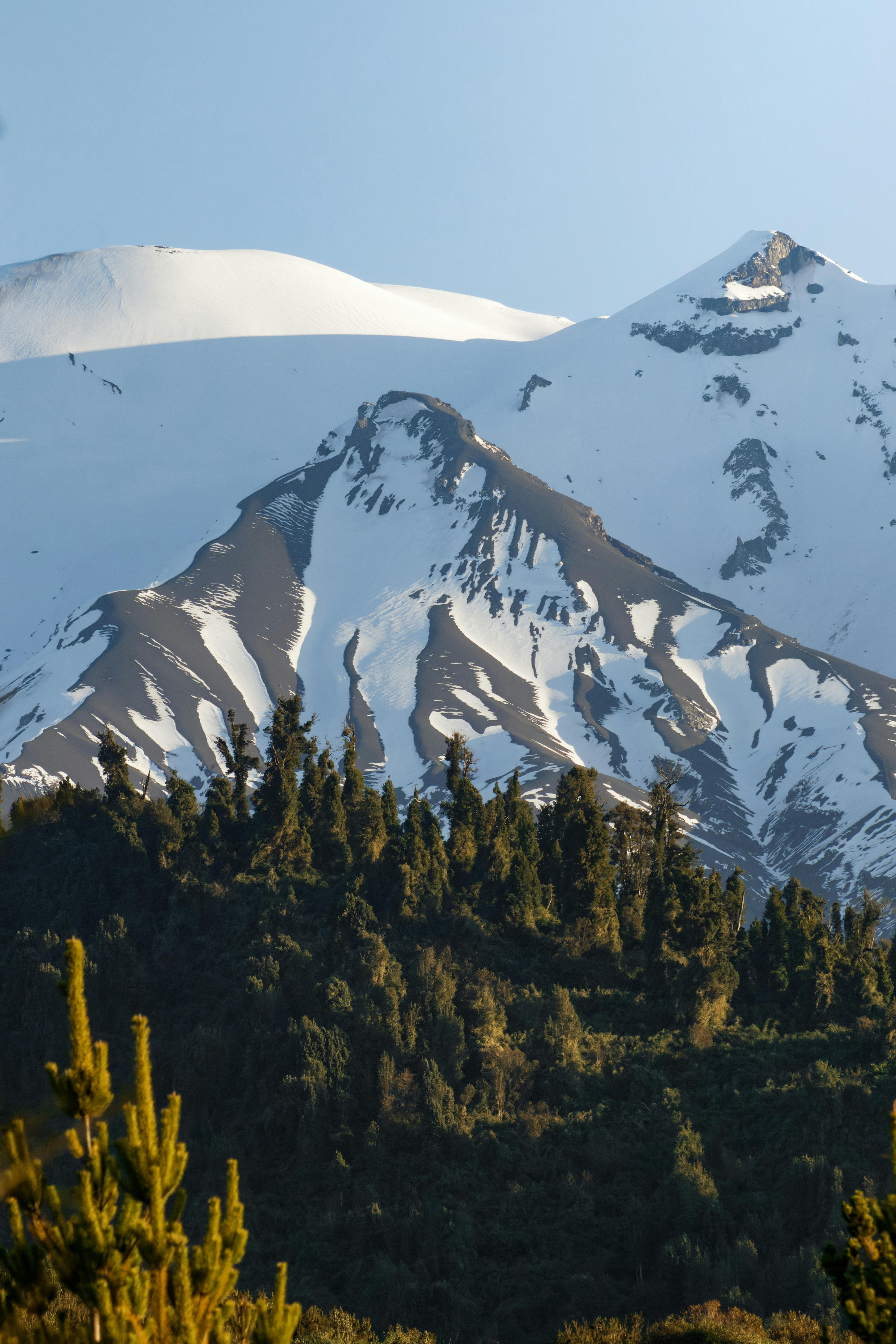 Scenic view of snow-capped mountains in Ensenada, Chile, showcasing natural beauty.
