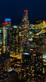 A breathtaking cityscape of Chicago's illuminated skyscrapers at night.