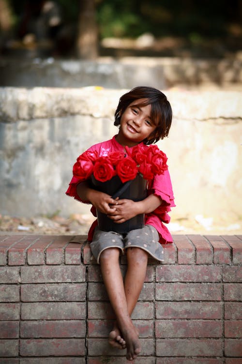 Girl Sitting with Roses