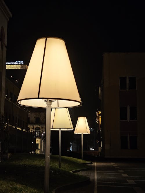 A lamp post with three lamps on it