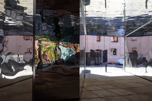 Free Abstract reflections on a mirrored building in Copenhagen, Denmark. Stock Photo