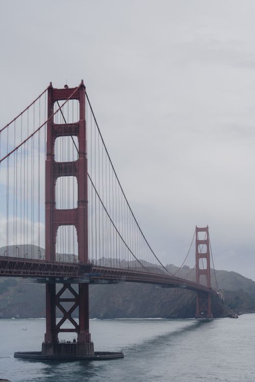 Free Iconic view of the Golden Gate Bridge shrouded in fog on a gloomy day in San Francisco. Stock Photo