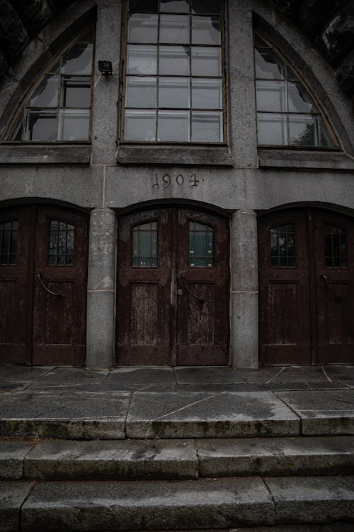 A building with two doors and a window