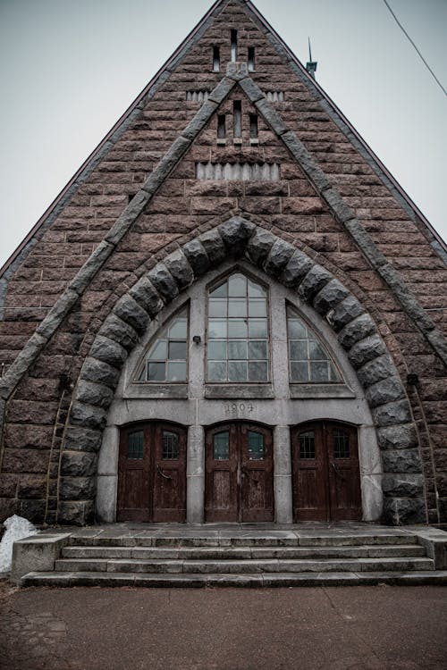 A church with a large stone door and windows