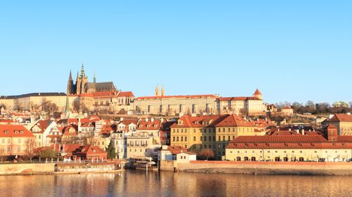 Free Beautiful panoramic view of Prague Castle and surrounding architecture under warm sunlight. Stock Photo