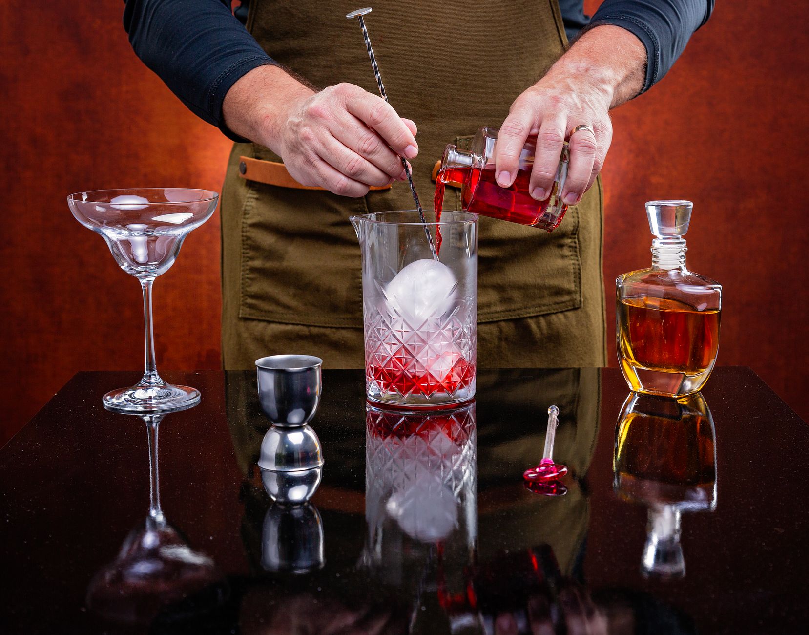 Negroni cocktail with an orange twist garnish on a rocks glass