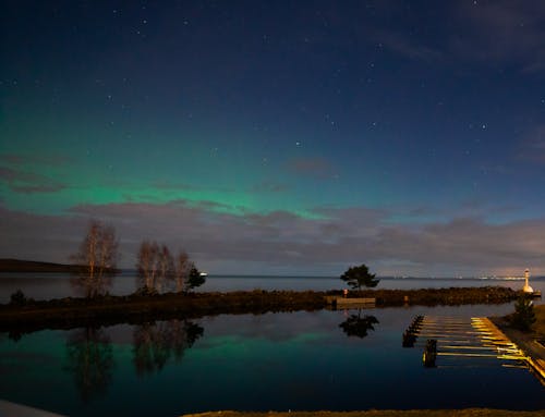 The aurora bore lights up the sky over a lake