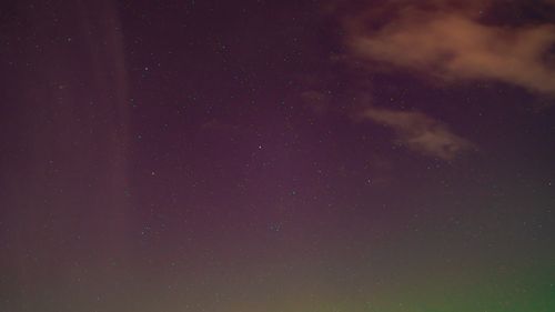 Free Captivating view of a starry night sky with a few scattered clouds and a gradient effect. Stock Photo