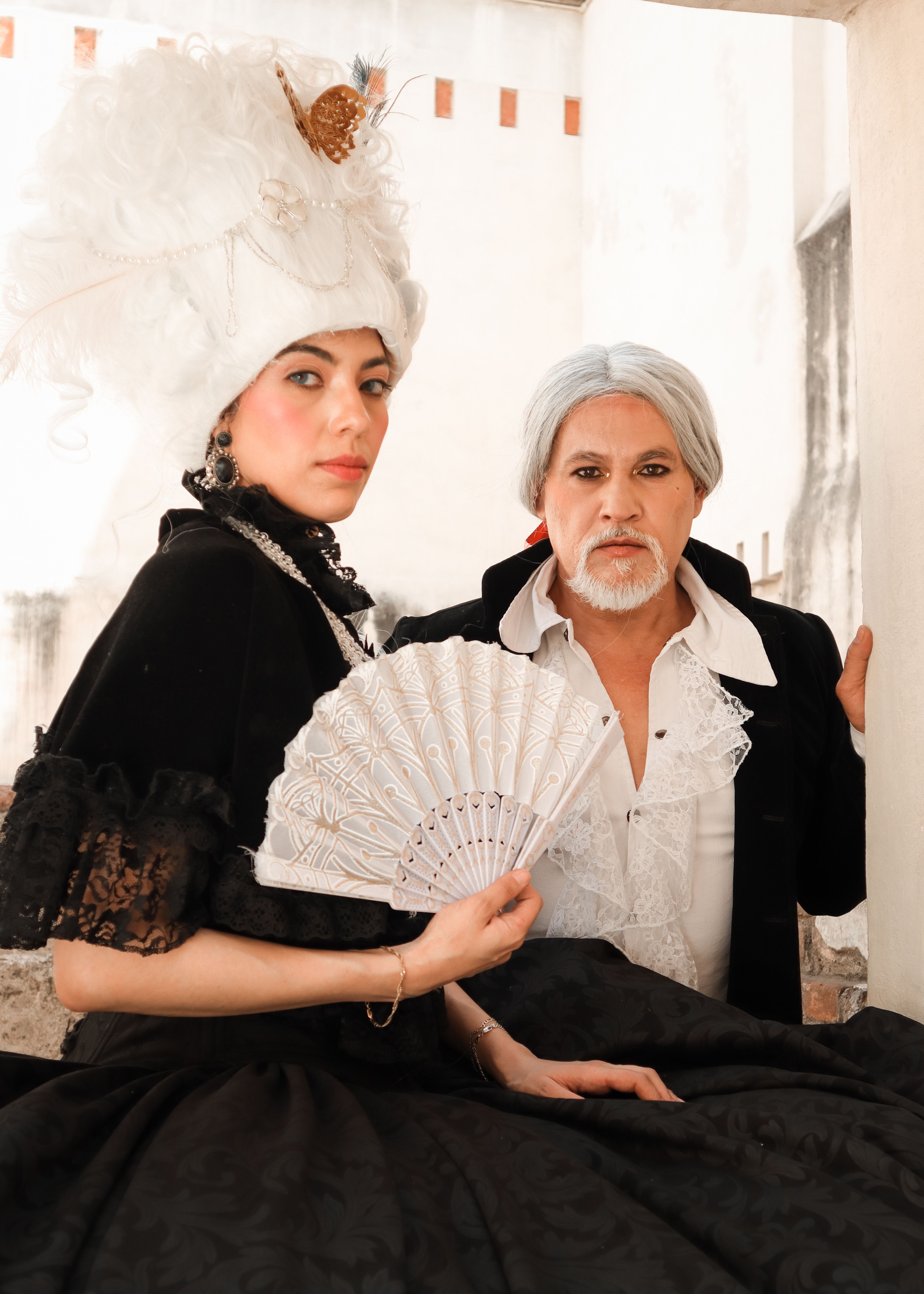 A Man and Woman Wearing Elegant Costumes and Wigs · Free Stock Photo