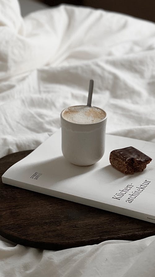 Coffee and Chocolate on Bed