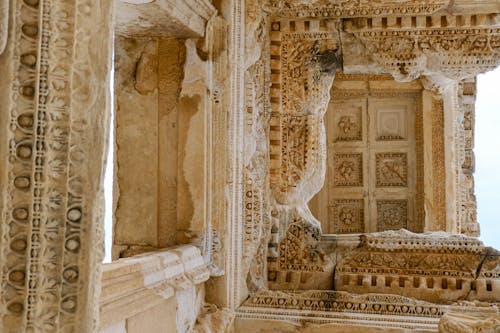 The ceiling of an ancient building with intricate carvings