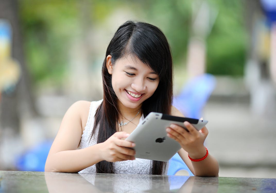 Free Woman Holding White Ipad Stock Photo