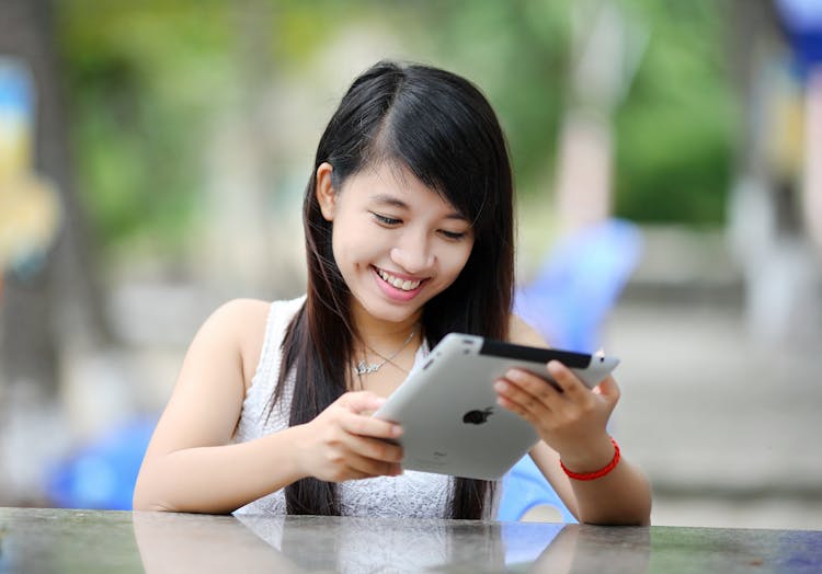 Woman Holding White Ipad