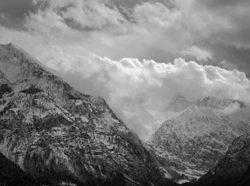 Black and white photograph of mountains and clouds