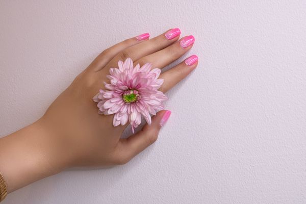Polished nails with delicate floral accent
