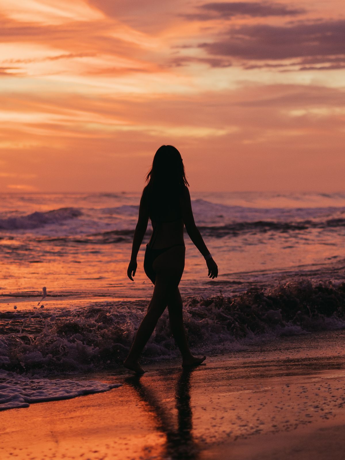 Woman in Black Bikini Walking on Beach · Free Stock Photo