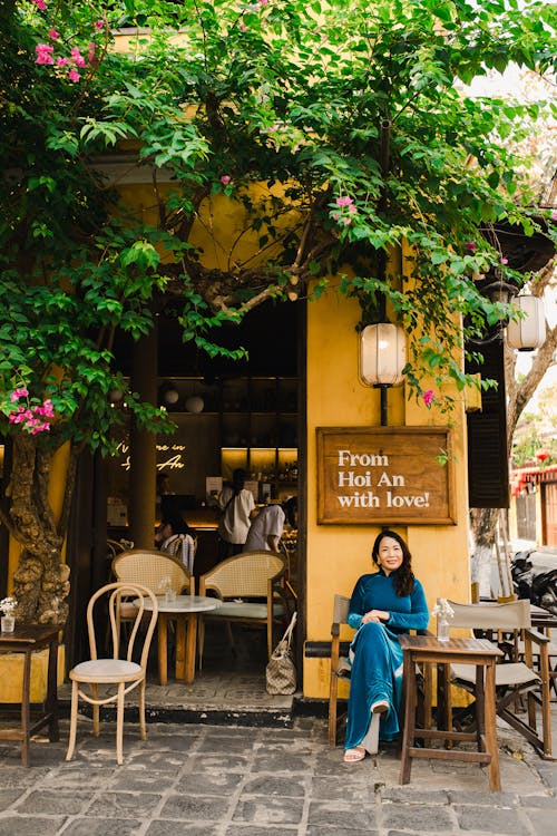 A woman sitting at a cafe in hoi an