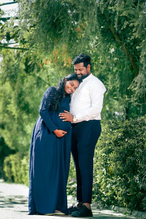 Portrait of Smiling Man in Shirt with Woman in Dress