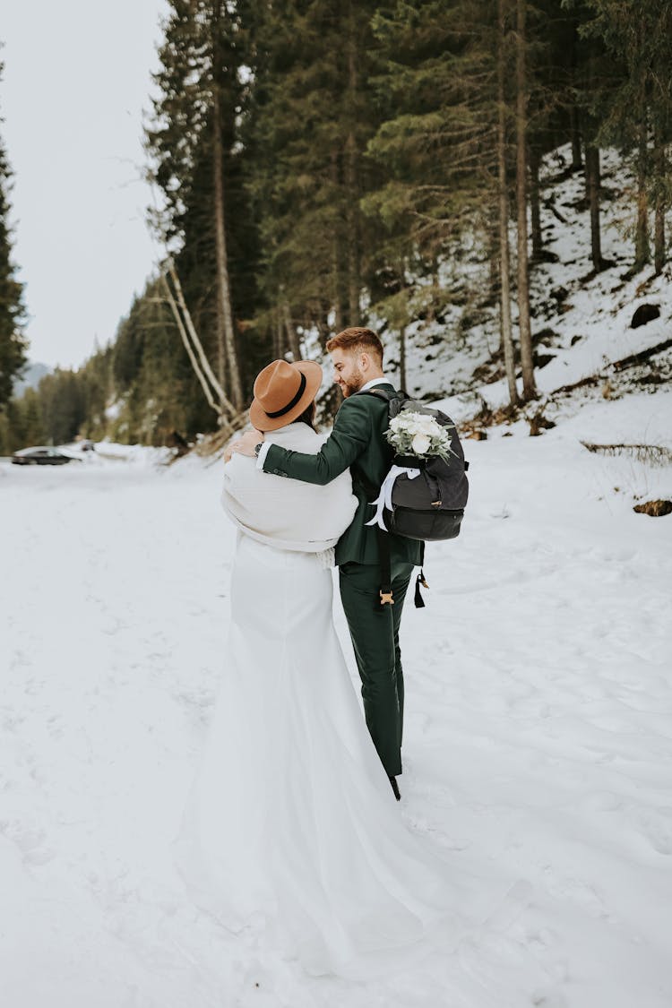 Newlyweds Together In Forest In Winter