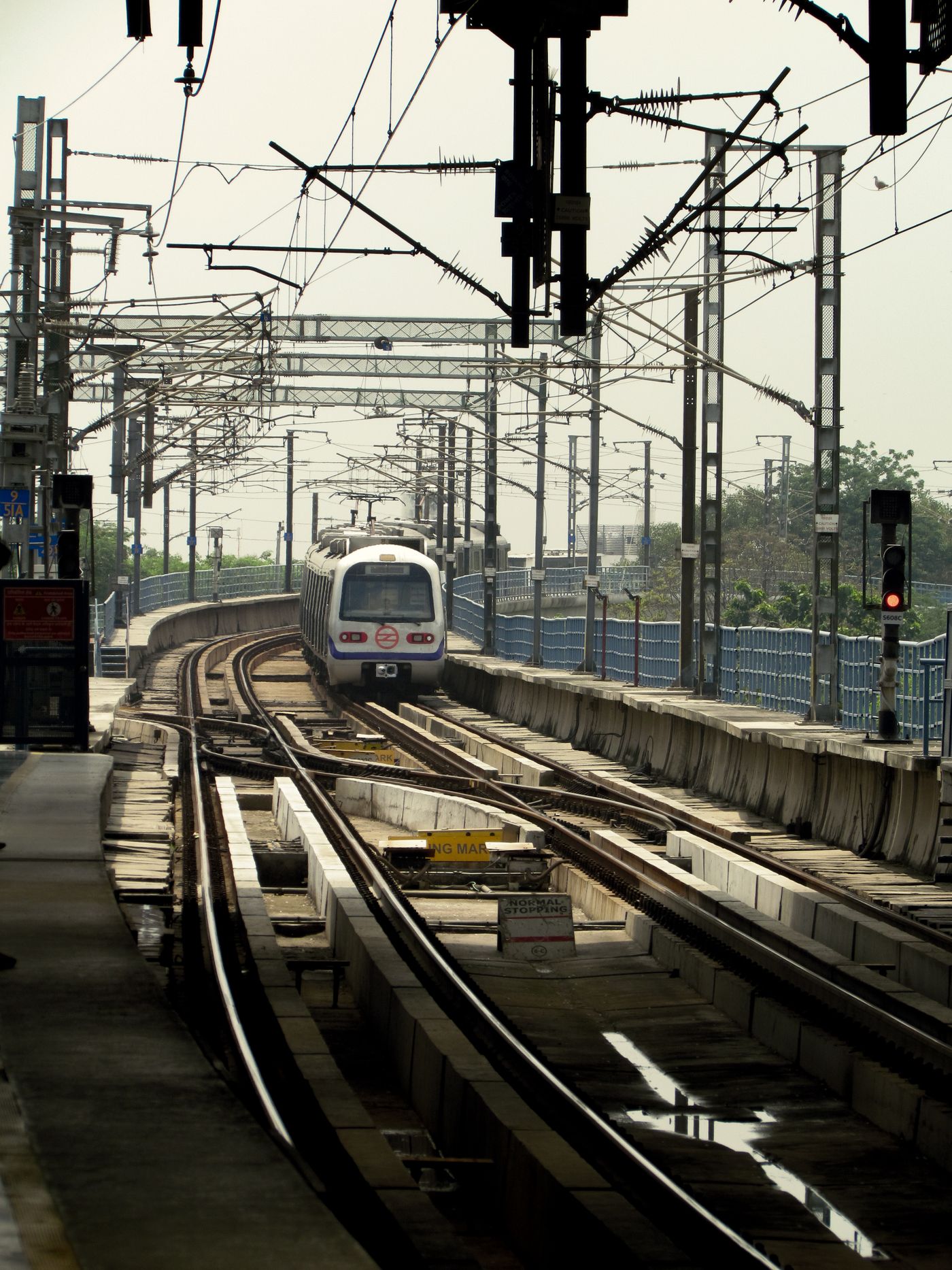 Metro train on electrified urban railway in New Delhi