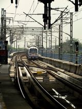 A metro approaching a New Delhi station