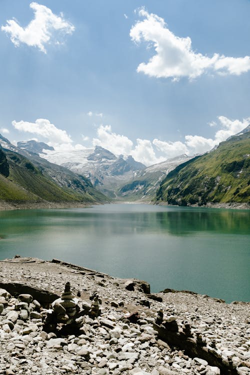 Free A lake surrounded by mountains and rocks Stock Photo