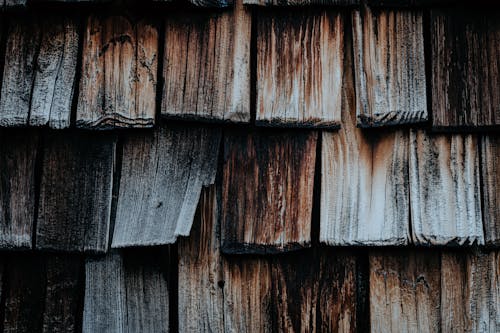 A close up of wood shingles on a roof