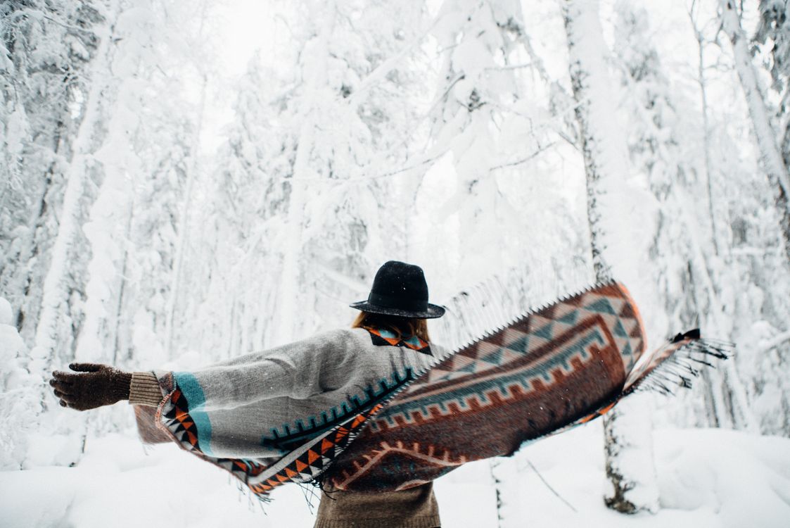 Woman in elegant winter poncho