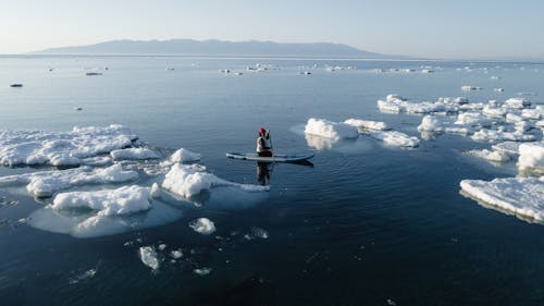 Sup surfing on spring Baikal Lake