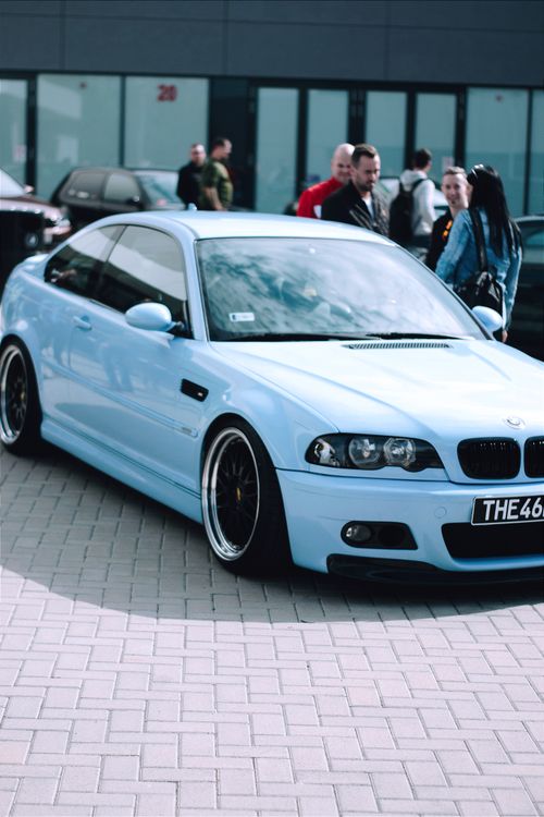 Free A sleek BMW E46 M3 with people gathering in an urban Hungary location. Stock Photo