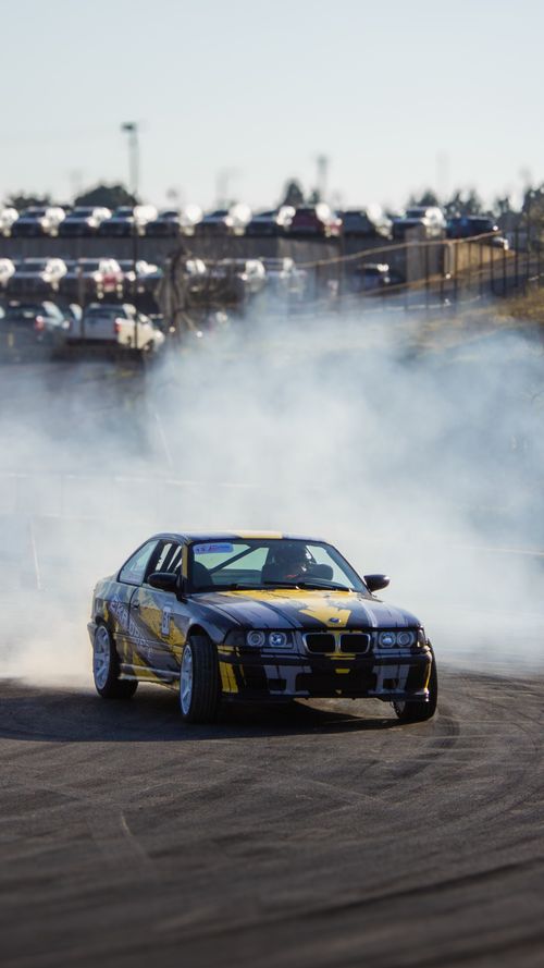 Free Action-packed car drifting scene at a motorsport event in Gebze, Türkiye, with smoke effects. Stock Photo