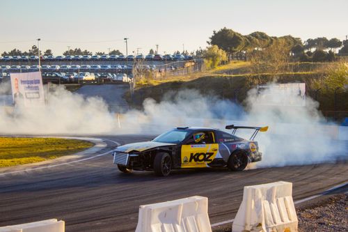 Free High-speed drift racing on a sunny day at Kocaeli Circuit, Türkiye. Stock Photo