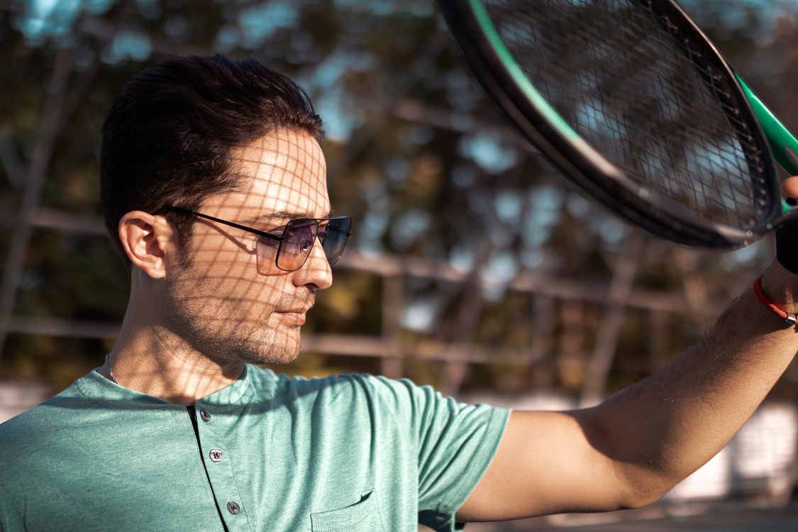Man Using Tennis Racket A Man with a Tennis Racket · Free Stock Photo