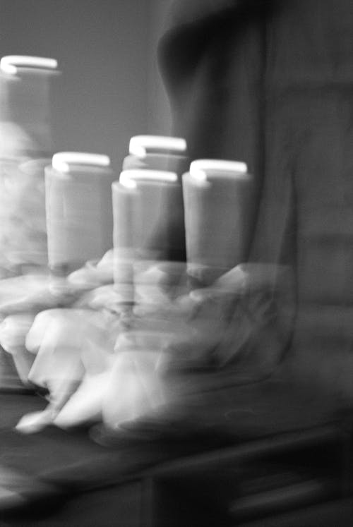 A black and white photo of a candle