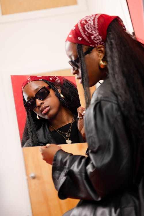 Woman in Black Jacket and Reflection in Mirror