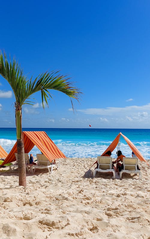 Two chairs and a beach umbrella on the beach