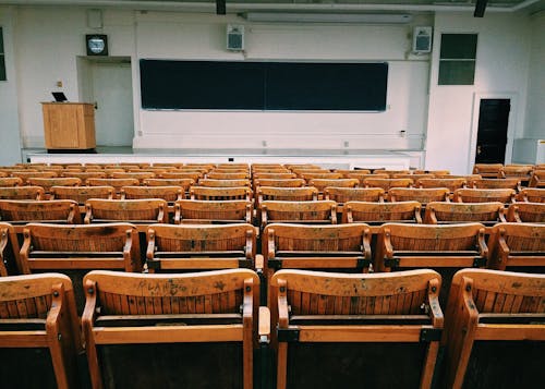 Free Brown and Black Wooden Chairs Inside Room Stock Photo