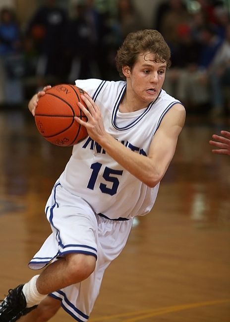 basketball point guard dribbling on court