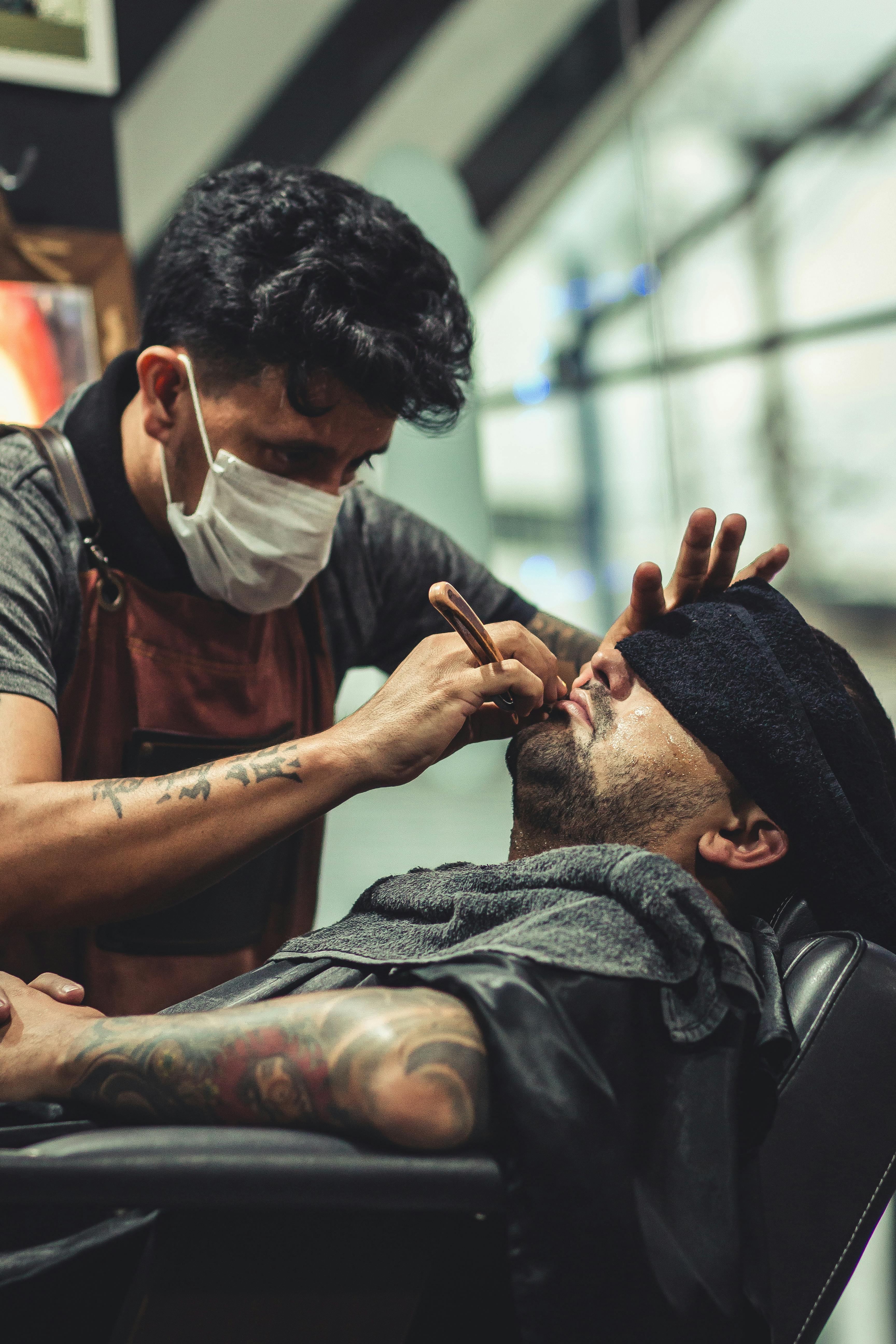 Man Shaving Man's Beard Using Straight Razor · Free Stock 