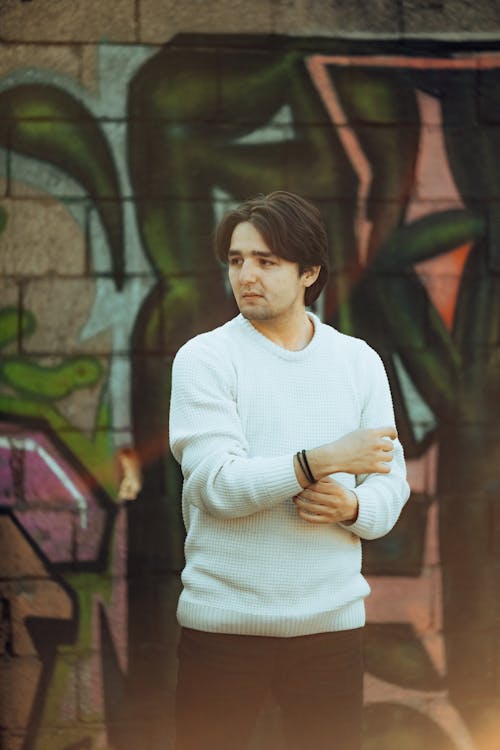 Portrait of Man in Front of Graffiti