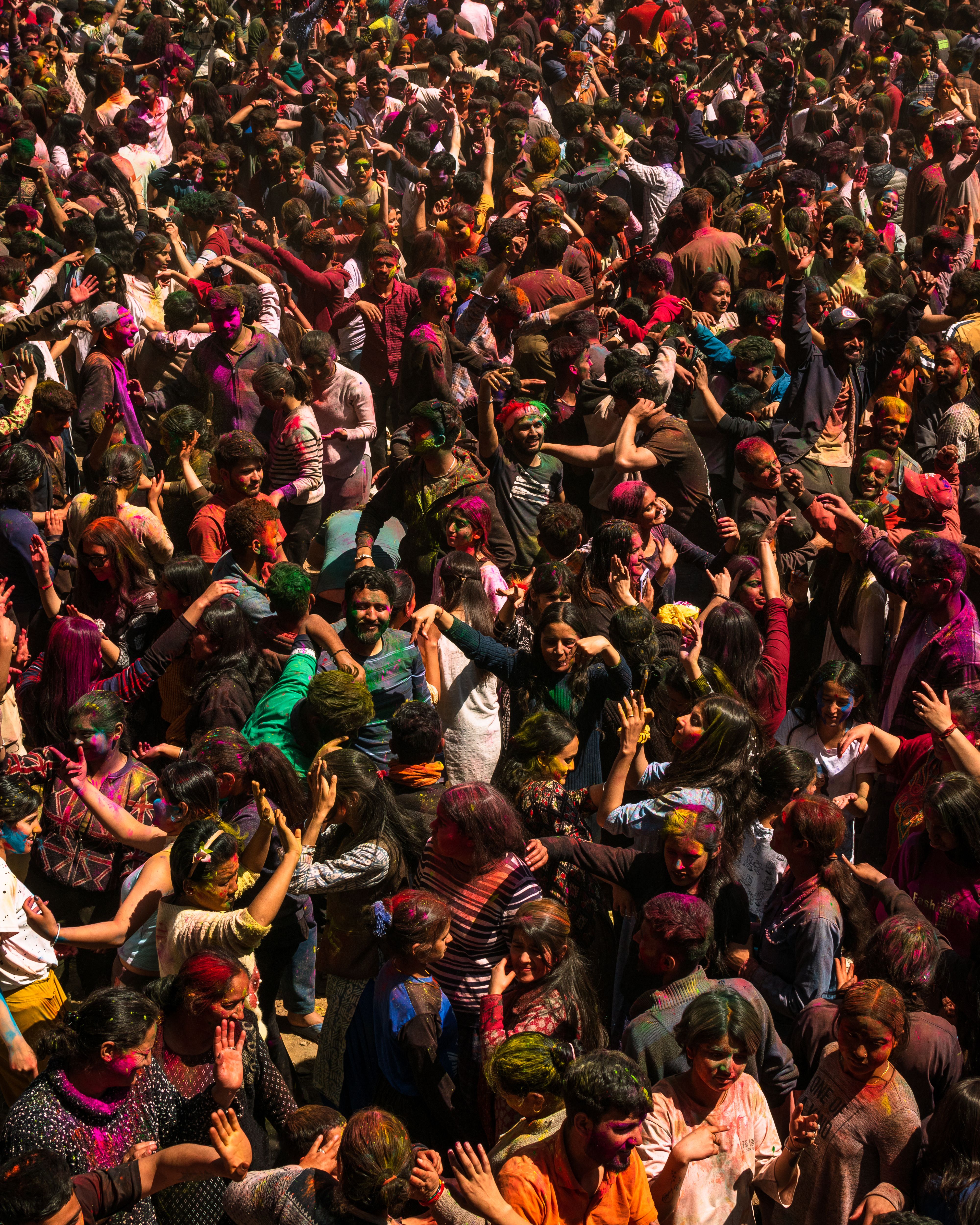 A crowd of people in colorful clothes and hats · Free Stock Photo