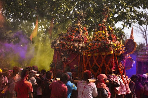 A colorful festival with people in the background